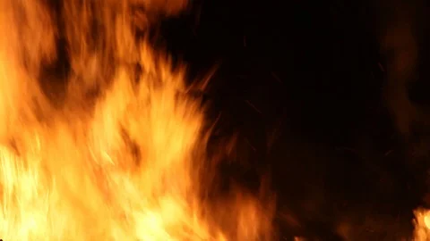 Quick pan to the right from flames to flames Stock Footage 122803372
