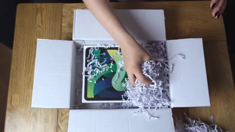 Quick parcel opening process,unpack iPad Air box,4th Generation,tablet by female Stockbeeldmateriaal 156800139