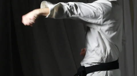 Quick punches are beating the athlete with a black belt Stock Footage 35219058