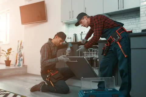 Quick service in real time. Workers solve household problems 写真素材