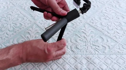 Quick Setup: Compact Tripod for Mobile Filming on Soft Surface Vídeo Stock 311695236