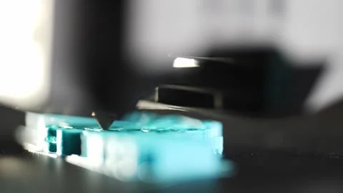 The quick, shallow movements of the 3D printer draw the detail in close-up. Stock Footage 314462121