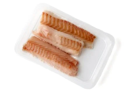 Quick shock frozen cod fillet in vacuum packaging isolated on white backgroun Stock Photos