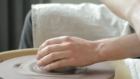 Quick shot of making a bowl on a potter's wheel by a man. Video stock 90132059