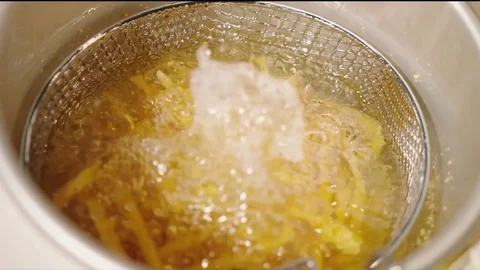 Quick shots of fast food being cooked Stockbeeldmateriaal 84900730