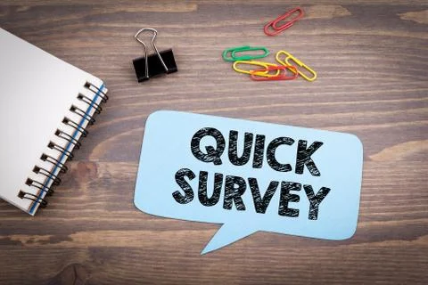 Quick Survey. Speech Bubble on a dark textured wooden background Stock Photos