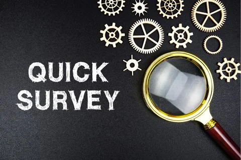 Quick Survey text message with magnifying glass on black background Stock Photos