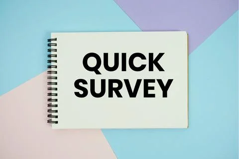 Quick Survey text written on notepad flat lay on multicolor pastel background Stock Photos