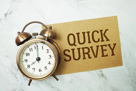 Quick Survey text written on paper card with alarm clock on marble background Stock Photos