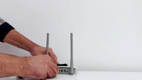 Quick Tech Setup: Plugging Ethernet into Dual-Antenna Router 스톡 동영상 318340086