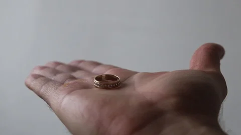 Quickly close palm with a wedding ring Stock Footage 123821654