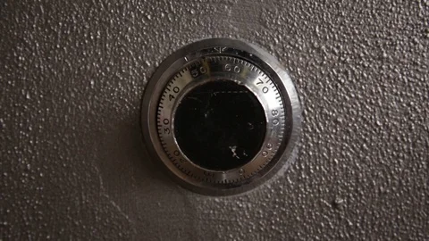 Quickly dialing a safe deposit lock and opening door Stock Footage 86894717