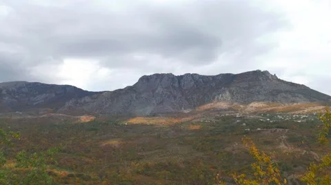 Quickly passing clouds over the mountains Video stock 68334333