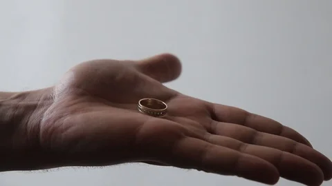 Quickly pick up wedding ring Stock Footage 123826971