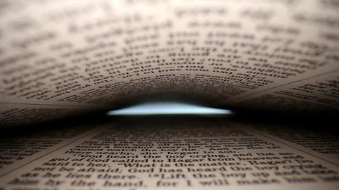 Quickly pushing lens into book &amp;then slowing down, a words eye view of the Stock Footage 111314975