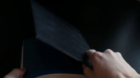 Quickly scrolling through the pages of the black book Stock Footage 73377177