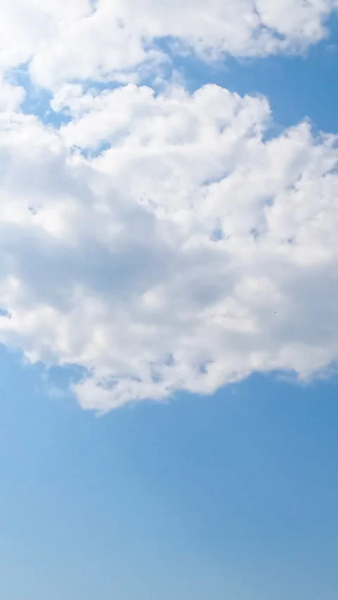 Quickly transforming white cloudscape in blue sky. Bright summer day with little Stock Footage 328628390