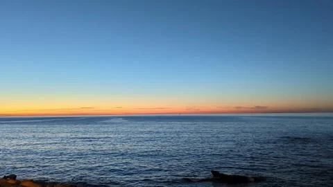 Quiet and calm waves sweeping over the sea - dreamlike landscape sunlight. Видео 241367868