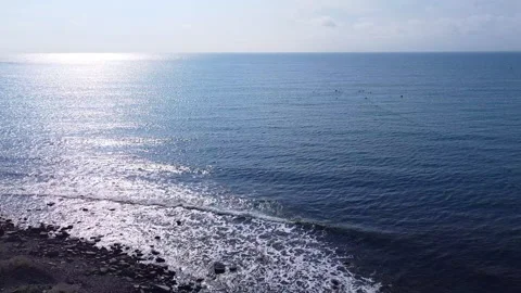 Quiet and soft waves beat against the stone shore. Stock Footage 151948765