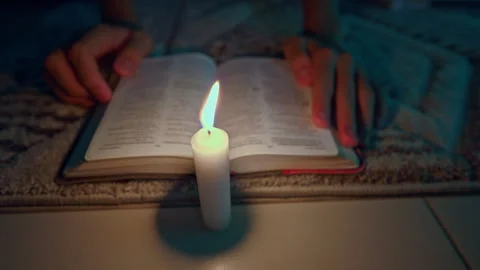 Quiet Bible Reading by Christmas Tree Light Stock Footage 323980658