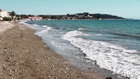 Quiet, calm beach landscape with soft waves and a serene coastal background Stock-Footage 313870461