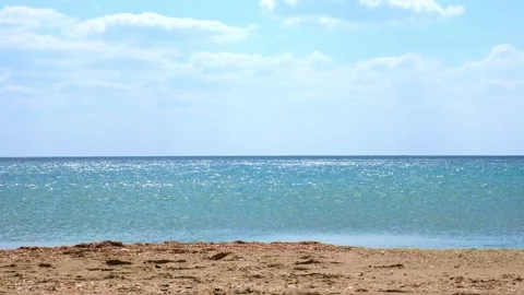 Quiet calm sea in the sunlight. Reflection of light on the waves of the sea Stock Footage 233847445