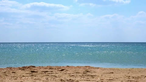Quiet calm sea in the sunlight. Reflection of light on the waves of the sea Stock Footage 234166729