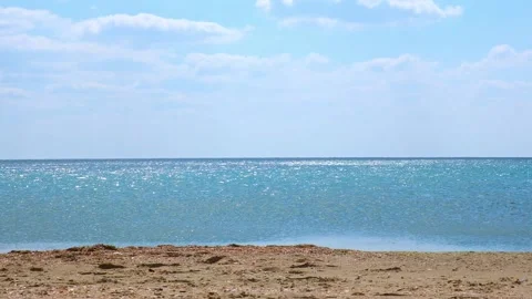 Quiet calm sea in the sunlight. Reflection of light on the waves of the sea Stock Footage 235316050