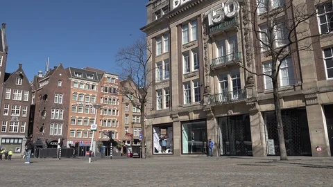 Quiet central Amsterdam in partial lockdown coronavirus pandemic Netherlands 動画素材 127119975