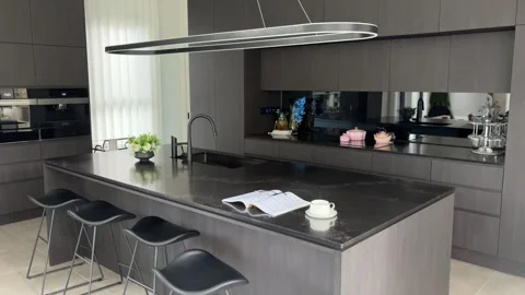 Quiet Coffee and Reading Moment in Modern Home Kitchen Stock Footage 342887964