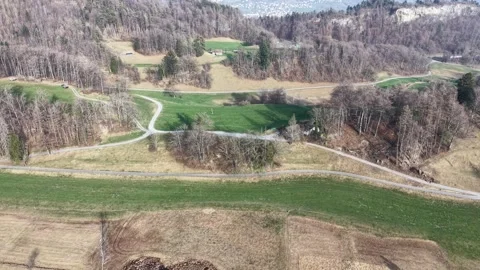 Quiet Country Path With Tiny Walking People In Swiss Countryside 스톡 동영상 330357696