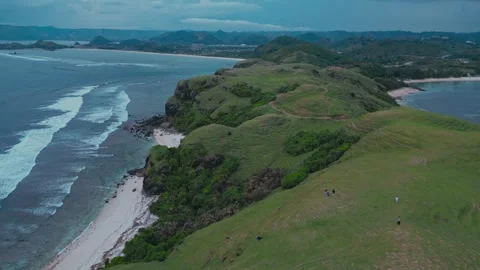 Quiet elevated area where person strolls by peaceful shoreline Video stock 333526101