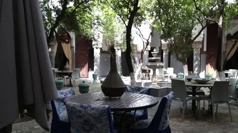 Quiet garden empty restaurant patio in Morocco Stock Footage 69109239