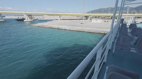 Quiet harbor seen from ferry deck railing in early morning light Stock Footage 338106566