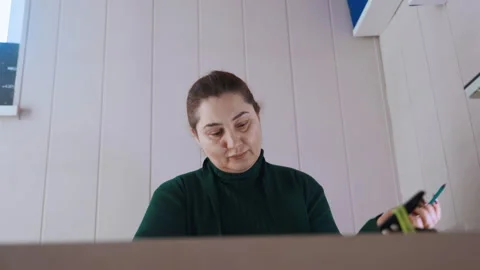 Quiet home office with paperwork and computer tools ready. Focused healthcare Stock Footage 342336731