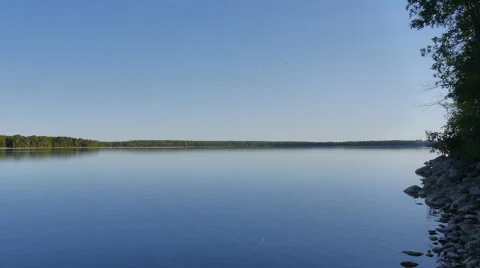 Quiet lake in Canada with trees and stones 스톡 동영상 68933192