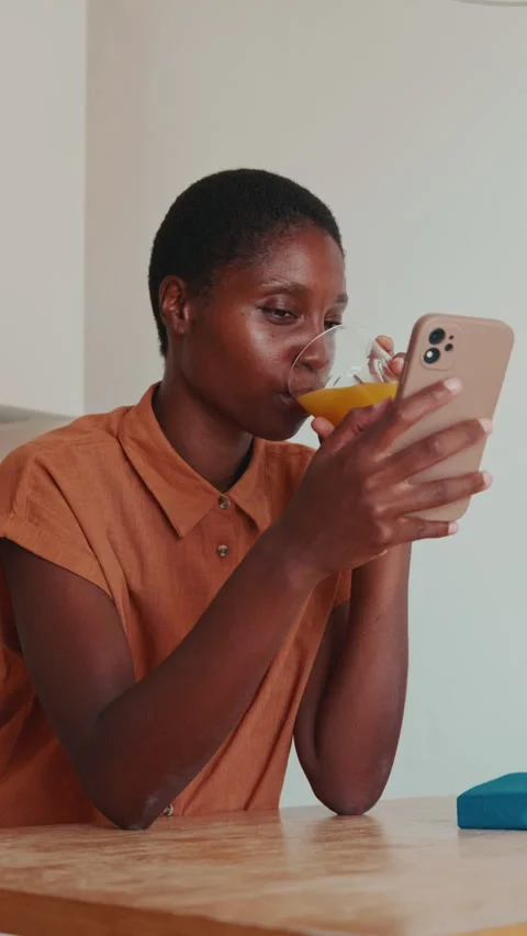 Quiet Moments: Reading a Book with Refreshing Orange Juice Stock Footage 328104083