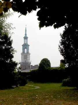 Quiet Path Through Lush Greenery With Poznan Town Hall Tower in the Distanc.. Stock Photos
