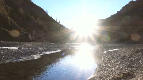 Quiet river and mountain landscape in sunlight Stock-Footage 71376356