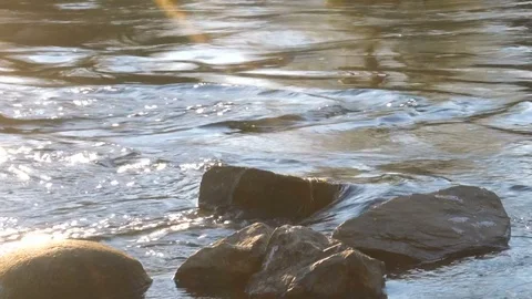 Quiet river and rocks at sunset Stock Footage 70739126
