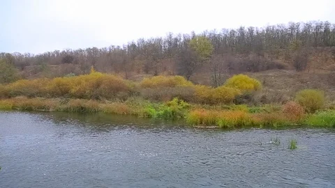 Quiet river at the grim misty day, autumn scene Stock Footage 121929430