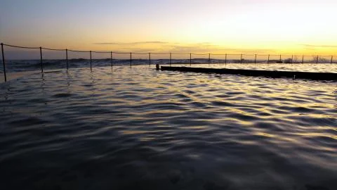 Quiet sea at sunset Stock Photos