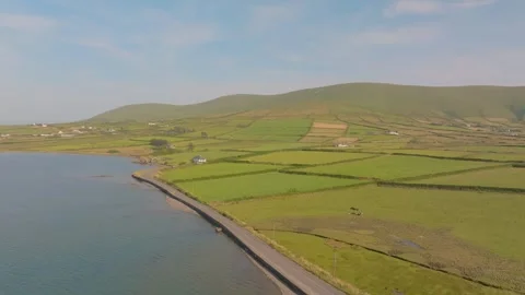 Quiet Shore Road Beside Patchwork Farmland On Valentia Island, Drone Fly Along Stock Footage 343726086