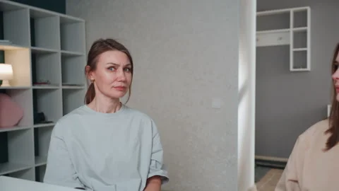 Quiet study area where teacher aids student with grammar rules. Comfortable home Stock Footage 336866823
