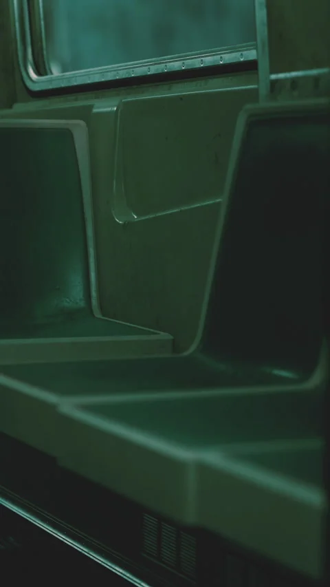 Quiet subway seats in an empty train during late night hours Stock Footage 338347583