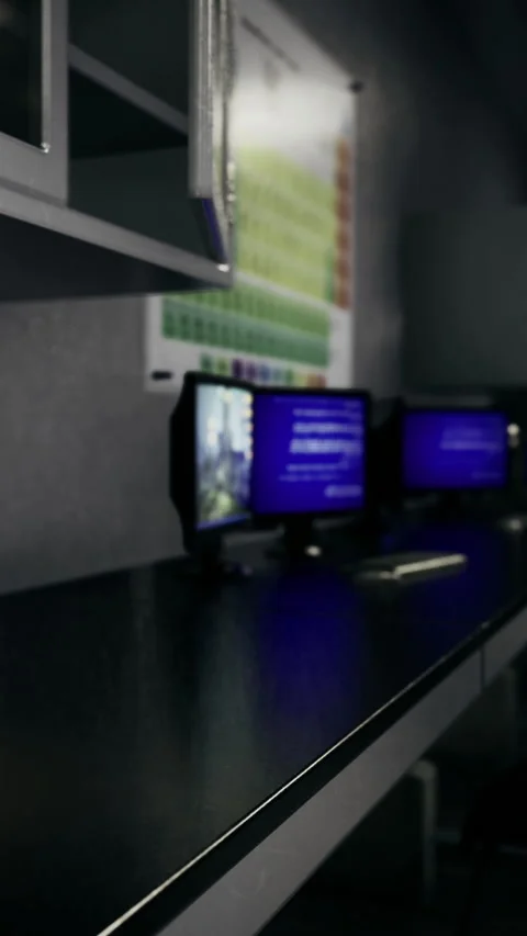 Quiet tech corner in a modern learning space filled with screens Stock Footage 334206332