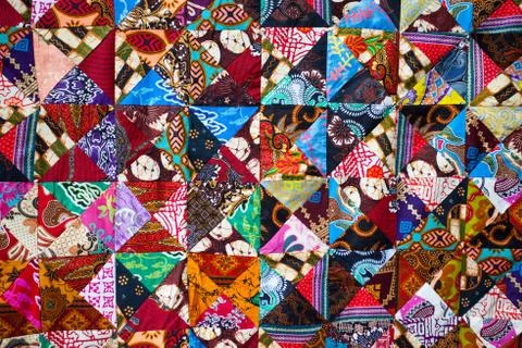 Quilt with distinct color abstract patterns, handmade domestic production Stock Photos