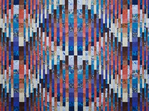 Quilt made in the style of bargello using the convergence effect 스톡 사진
