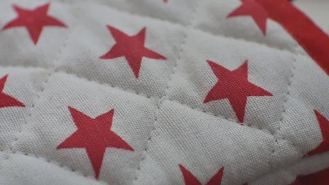 Quilt textile with red star pattern, close up on intricate craftsmanship Stock Footage 109408391