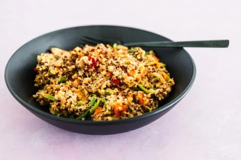 Quinoa with mixed veggies, plant-based food Stock Photos